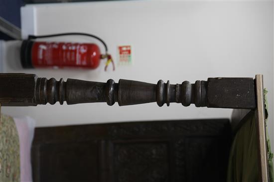 A 17th century carved oak tester bed, W.4ft 6in. H.6ft 1in. L.7ft 2in.